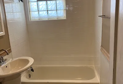 Bathroom after reglazing with smooth, glossy, like-new surfaces