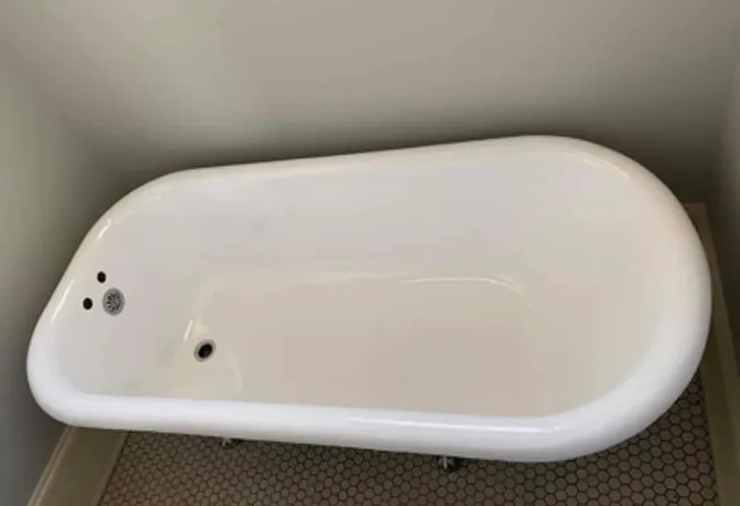 Refinished bathtub after reglazing with bright white, durable coating