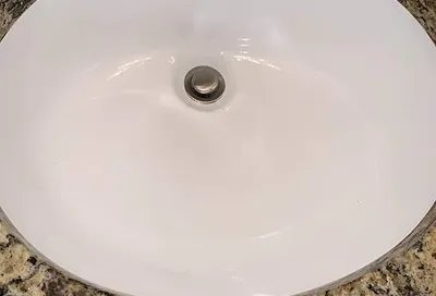 Refinished sink after reglazing looking clean and restored