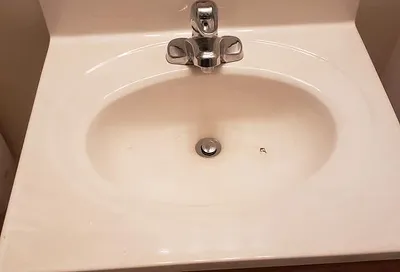 Like-new sink after reglazing with fresh durable coating