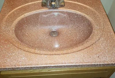 Worn sink surface before professional reglazing service