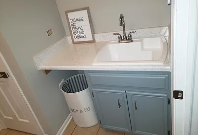 Restored sink basin after reglazing with bright, polished surface