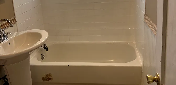 Restored bathroom tiles after reglazing with smooth, glossy finish