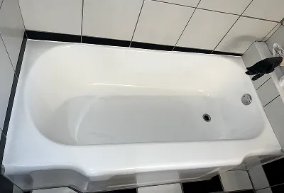 After bathtub reglazing with smooth, glossy, like-new refinished bathtub