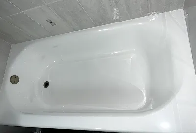 Bathtub after reglazing with smooth, bright, restored finish