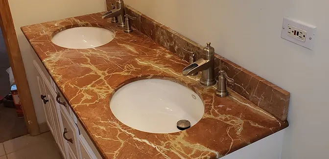 Aged sink basin before reglazing with dull finish and visible stains