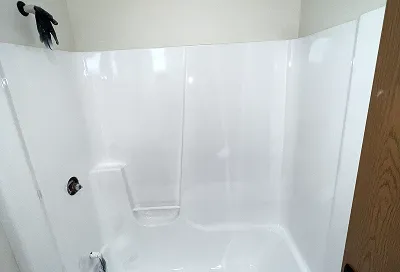 Tile after reglazing with smooth, glossy, restored surface