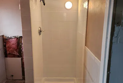 Rejuvenated tiles after reglazing with durable, polished coating