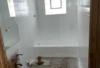 Rejuvenated tiles after reglazing with durable, polished coating