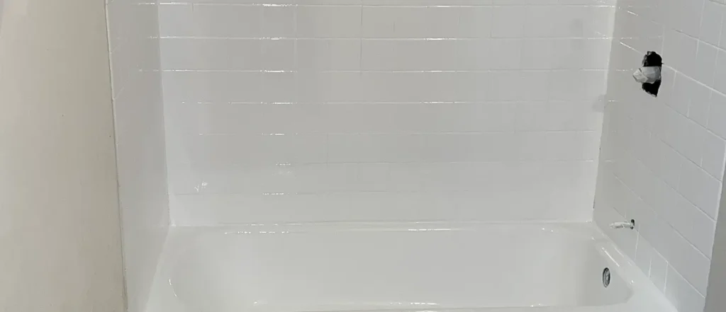 a bathtub with white tile