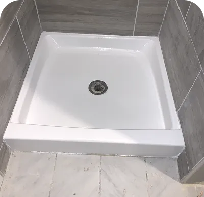 Professional refinishing of shower pans and basins