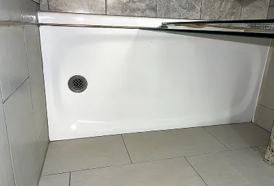 Shower stall after professional reglazing fully refreshed