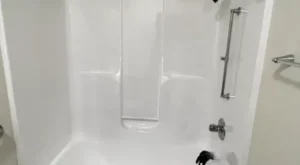 Professional refinishing of a platform drop-in bathtub